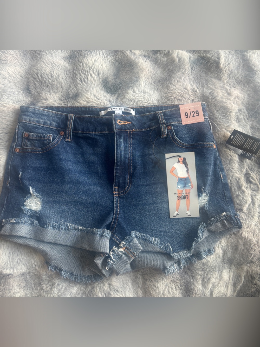 Celebrity pink must haves 👀 Distressed Mid-Rise Denim Shorts in Blue